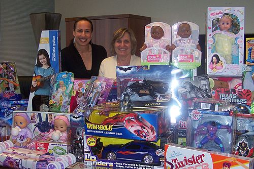 Dany Garcia and Joyce J. Elam with toys secured through the generosity of the College of Business Administration’s leadership team