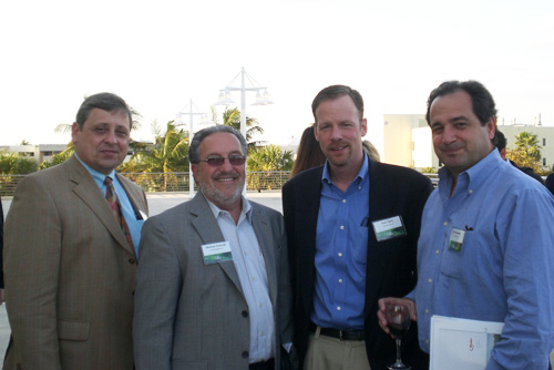 From left to right: Walfried Lassar, Ryder Professor and director of the Ryder Center; Michael Pontrelli and Paul Ligon from Waste Management; and Rick Basseda, Bacardi.