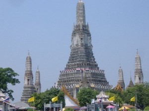 Wat Arun, the Temple of Dawn, in Bangkok, seen from the seen from a tour boat on the Chao Phraya River