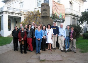 Participants in the 13th Mercosur Professional Development in International Business at the Museo Fonck in Viña Del Mar in front of an Easter Island head