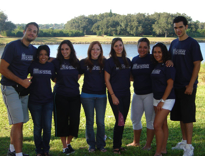 From left to right: Andrew Plotnikow, Angelena Adams, Yanyn San Luis, Kelly Dobert, Joni Deckerd, Issa Chaves, Carolina Rivera and Gabriel Oms enjoy the serenity of a riverside retreat during the Academy of Leaders training.