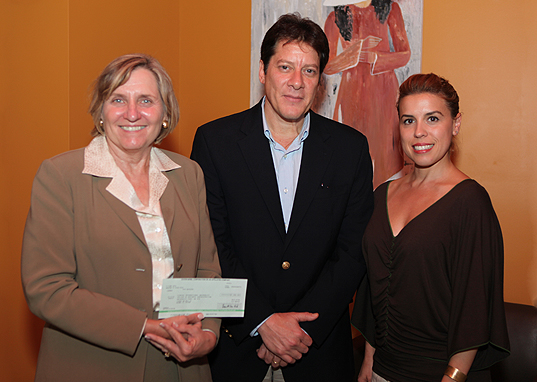 Miguel A. Arrieta, presented a check for $7,500 from ExxonMobil to Joyce J. Elam and Monique Catoggio.