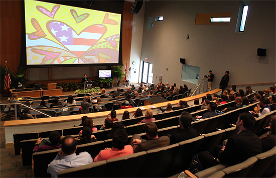 Romero Britto speaks to a large crowd at Florida International University