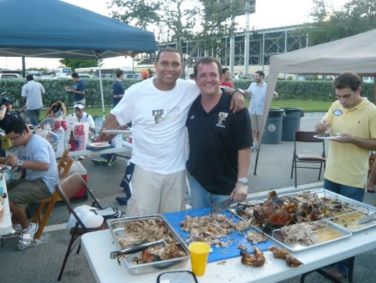 Padron got the tailgating effort underway on September 26, 2009 before the FIU-Toledo game. He and Frank Pena (BBA ’99) prepared roast pig Caja China style.