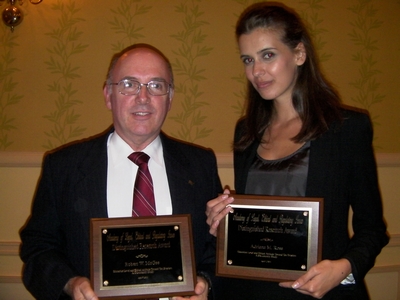 Robert W. McGee and Adriana M. Ross with their research award at the Allied Academies conference in Orlando, Florida.