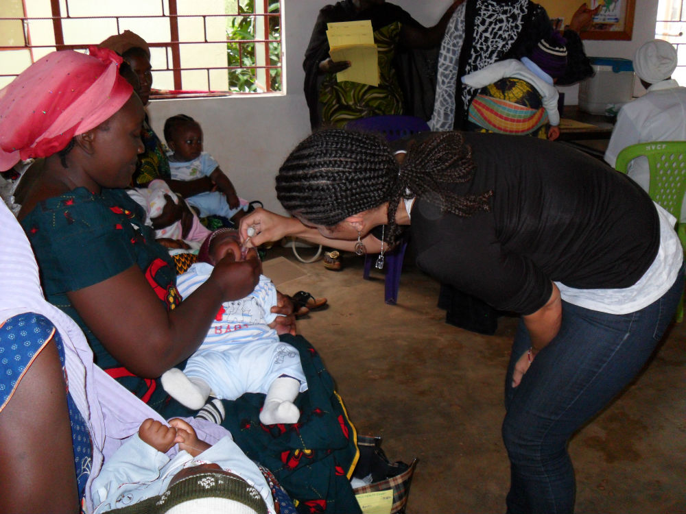 Giving polio immunizations to infants at the HVCF on-site clinic