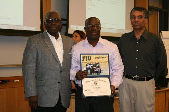 Keynoter speaker Dumas M. Simeus; Valentin Abe, subsequently named 2011 Digicel Entrepreneur; and Dileep Rao, faculty director and instructor. Photo by Liezel Quintana.