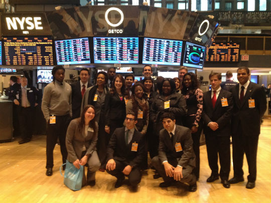 The group from Northwestern Senior High and FIU on the floor of the New York Stock Exchange