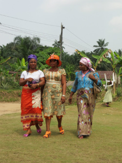 The village runway: women wearing colorful Nigerian fashions at a celebration in Afaha