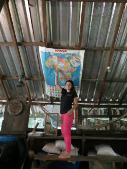 Pointing to Nigeria on a map of the African continent at a cabin in the Rhoko rainforest of Cross River State