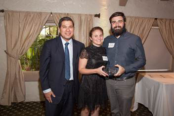 Daisy Nodal and Tom Pupo, founders of Moonlighter Lounge, receive the award for Emerging Business of the year
