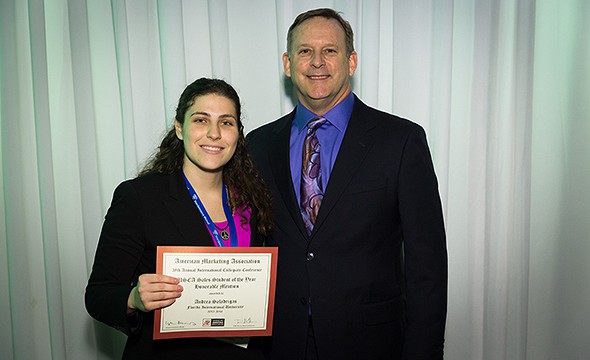 AMA@FIU member Andrea Saladrigas holding her award and Jimmy Peliter, AMA Collegiate Chapters Council President