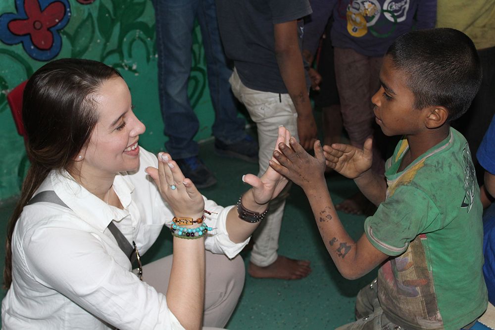 MAGA student Gabriele Gosco plays with one of the children at Salaam Balak Trust Shelter for homeless orphans, New Delhi